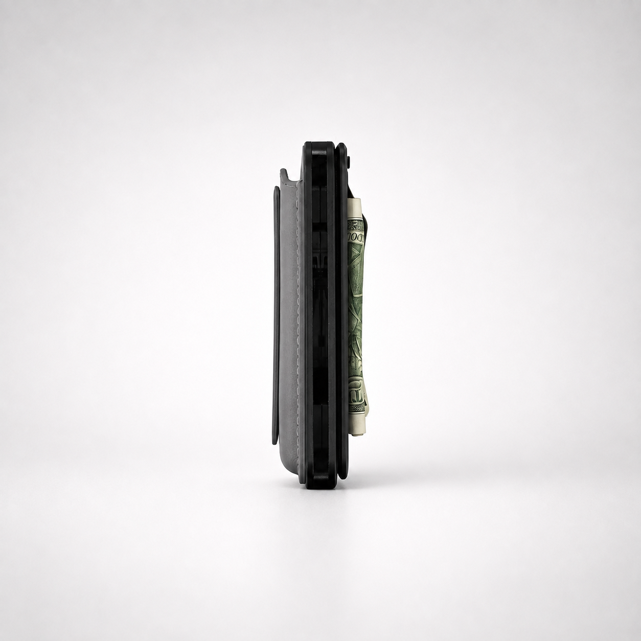 Side profile of the Maverick MagSafe Money Clip showing its slim thickness on a Maverick wallet
