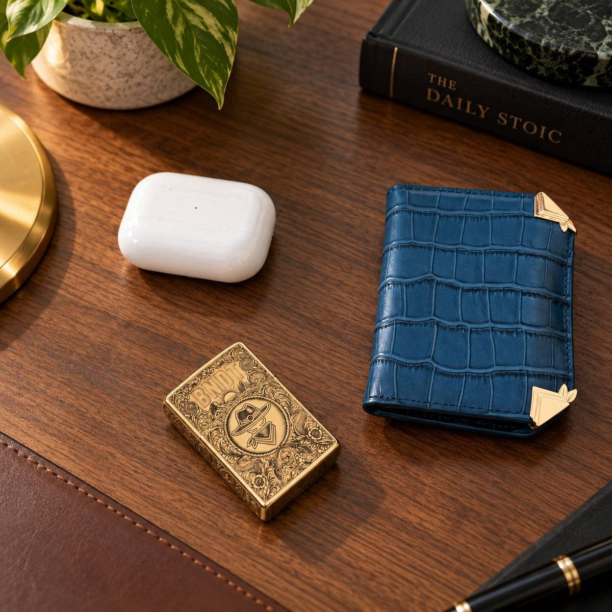 BNDT Brass Lighter on a desk with a Storm Blue Tycoon
