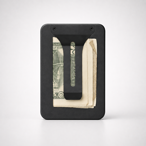 Maverick MagSafe Money Clip attached to a BNDT wallet holding folded bills and receipts