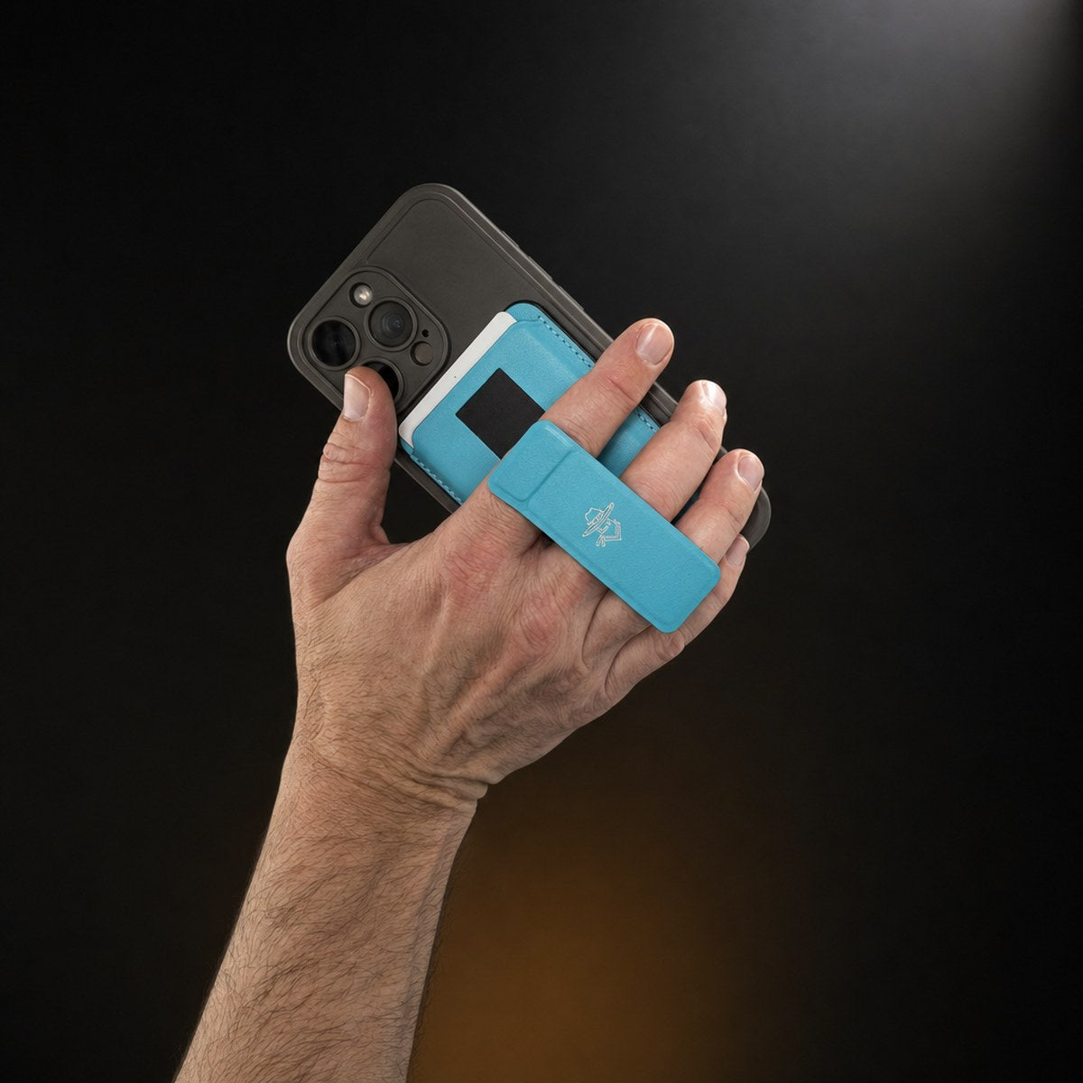 Maverick 2.0 dual grip and stand held between two fingers