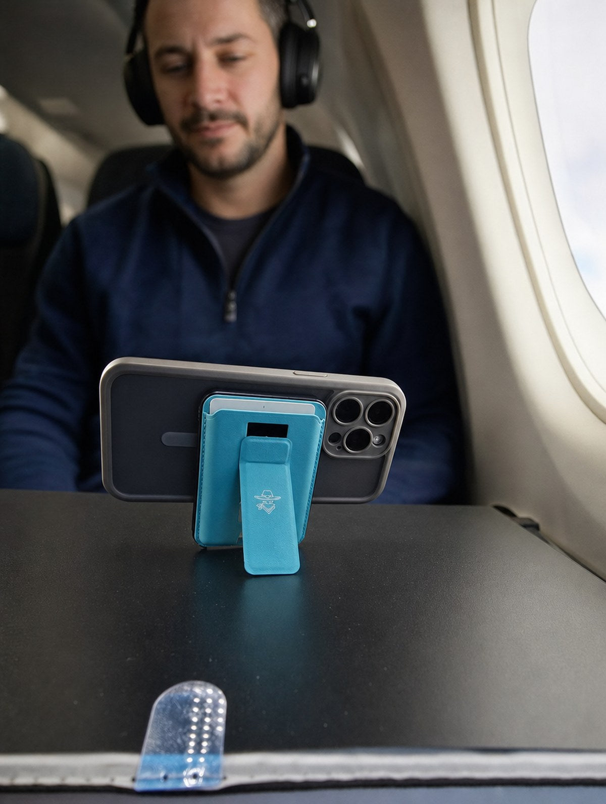 Maverick 2.0 standing on an airline tray table